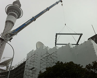 Large crane lifts Steel-boxed staircase